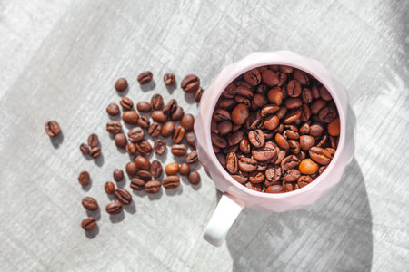 coffee beans in cup on the tableの写真素材