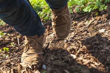 Man walking in the forest close up view