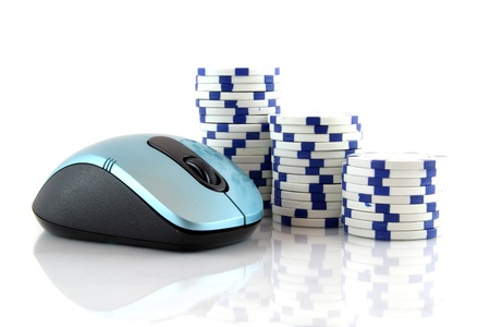 Online gaming and gambling concept, a mouse and blue casino chips on white backgroundの写真素材