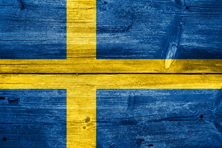Sweden Flag painted on old wood plank backgroundの写真素材