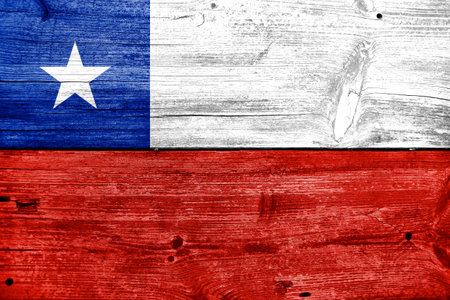 Chile Flag painted on old wood plank backgroundの写真素材