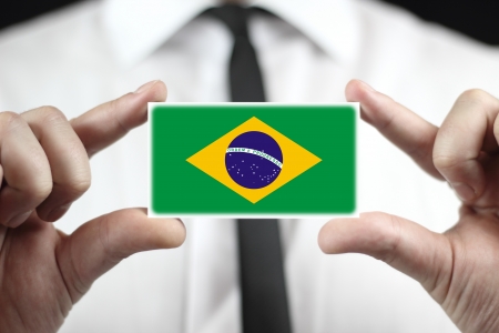 Businessman holding a business card with a Brazil Flagの写真素材