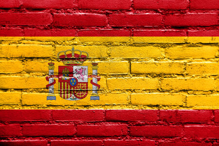 Spain Flag painted on brick wallの写真素材