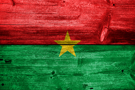 Burkina Faso Flag painted on old wood plank textureの写真素材