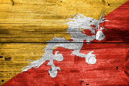 Bhutan Flag painted on old wood plank textureの写真素材