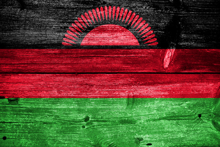 Malawi Flag painted on old wood plank textureの写真素材