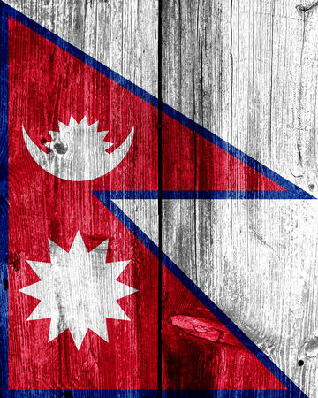 Nepal Flag painted on old wood plank textureの写真素材