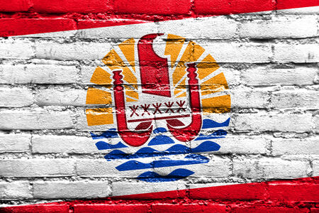 French Polynesia Flag painted on brick wallの写真素材