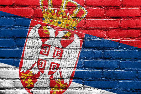 Serbia Flag painted on brick wallの写真素材