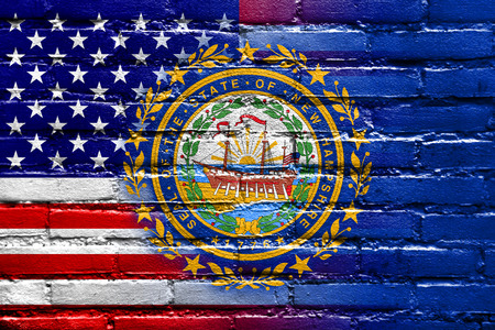 USA and New Hampshire State Flag painted on brick wallの写真素材