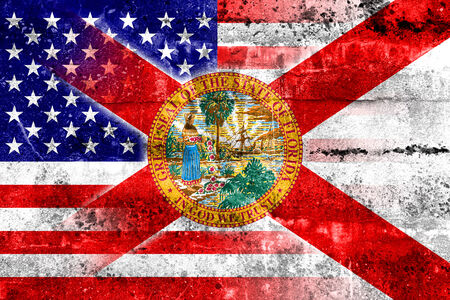 USA and Florida State Flag painted on grunge wallの写真素材