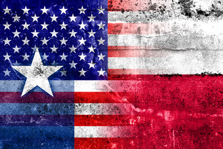 USA and Texas State Flag painted on grunge wallの写真素材