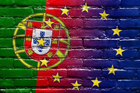 Portugal and European Union Flag painted on brick wallの写真素材