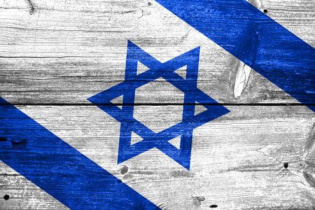 Israel flag painted on old wood plank backgroundの写真素材