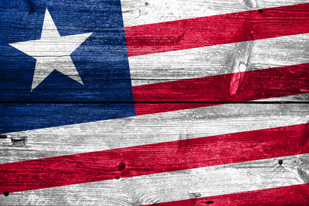 Liberia Flag painted on old wood plank textureの写真素材