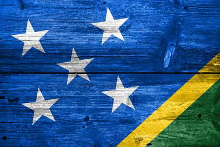 Solomon Islands Flag painted on old wood plank textureの写真素材
