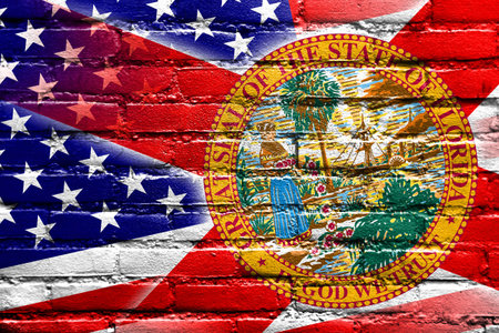 USA and Florida State Flag painted on brick wallの写真素材