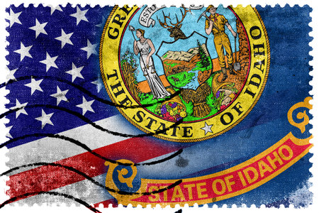 USA and Idaho State Flag - old postage stampの写真素材
