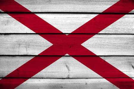 Alabama State Flag on wood backgroundの写真素材