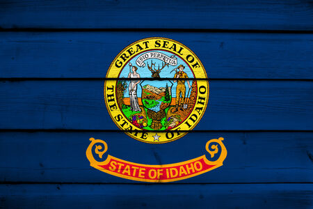 Idaho State Flag on wood backgroundの写真素材