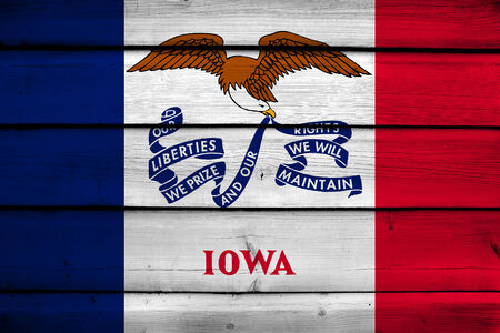 Iowa State Flag on wood backgroundの写真素材
