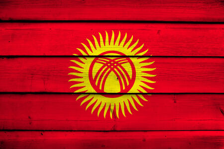 Kyrgyzstan Flag on wood backgroundの写真素材