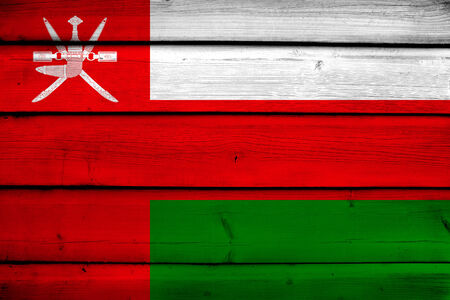 Oman Flag on wood backgroundの写真素材