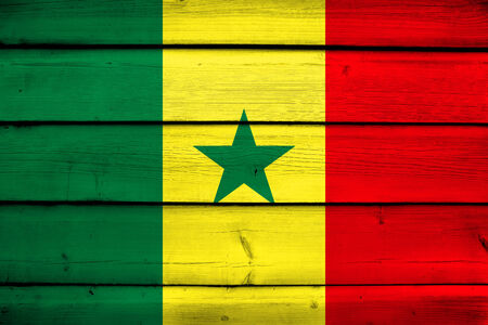 Senegal Flag on wood backgroundの写真素材