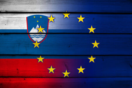 Slovenia and European Union Flag on wood backgroundの写真素材