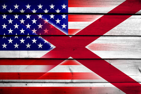 USA and Alabama State Flag on wood backgroundの写真素材