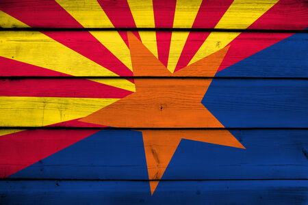 Arizona State Flag on wood backgroundの写真素材
