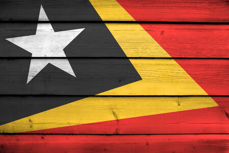 East Timor Flag on wood backgroundの写真素材
