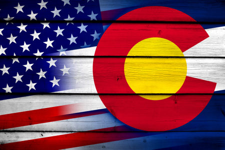 USA and Colorado State Flag on wood backgroundの写真素材