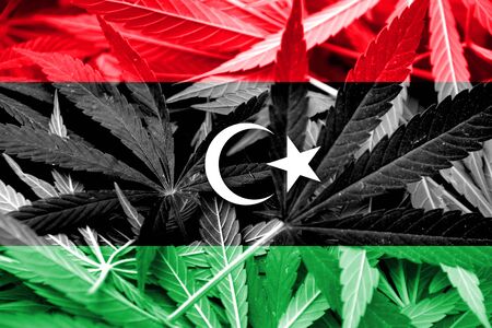 Libya Flag on cannabis background. Drug policy. Legalization of marijuanaの写真素材
