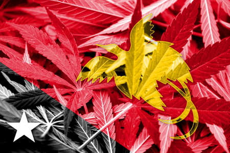 Papua New Guinea Flag on cannabis background. Drug policy. Legalization of marijuanaの写真素材