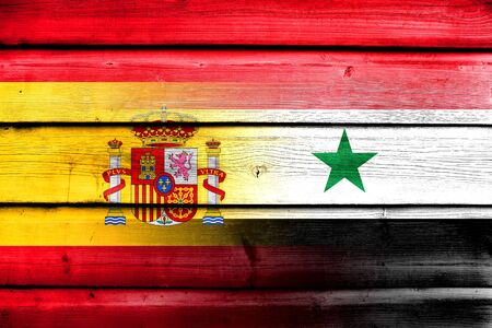 Syria and Spain Flag on wood backgroundの写真素材