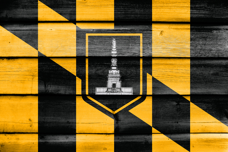 Flag of Baltimore, Maryland, painted on old wood plank backgroundの写真素材