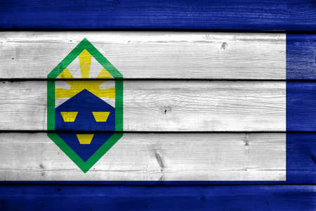Flag of Colorado Springs, Colorado, painted on old wood plank backgroundの写真素材