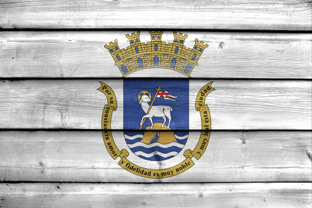 Flag of San Juan, Puerto Rico, painted on old wood plank backgroundの写真素材