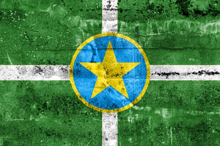 Flag of Jackson, Mississippi, painted on dirty wall. Vintage and old look.の写真素材