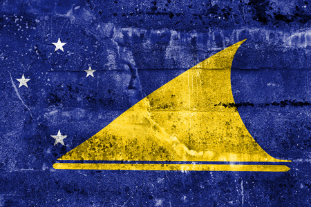 Flag of Tokelau, painted on dirty wall. Vintage and old look.の写真素材