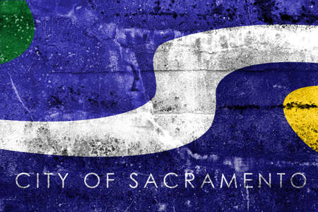 Flag of Sacramento, California, painted on dirty wall. Vintage and old look.の写真素材