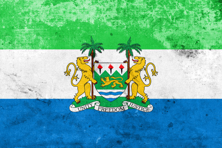 Flag of Sierra Leone with Coat of Arms, with a vintage and old lookの写真素材