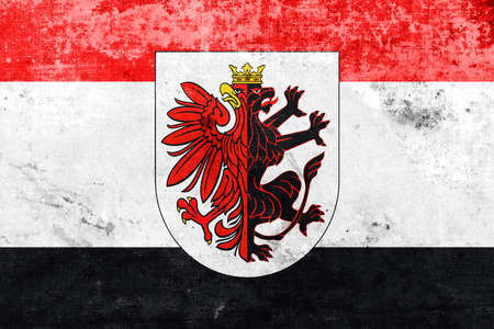 Flag of Kuyavian-Pomeranian Voivodeship with Coat of Arms, Poland, with a vintage and old lookの写真素材