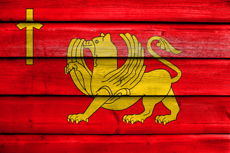 Flag of Kaspi, Georgia, painted on old wood plank backgroundの写真素材