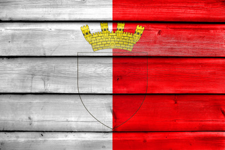 Flag of Mdina with Coat of Arms, Malta, painted on old wood plank backgroundの写真素材