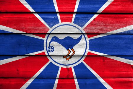 Flag of Melekeok State, Palau, painted on old wood plank backgroundの写真素材