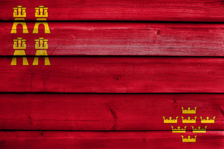 Flag of Murcia Region, Spain, painted on old wood plank backgroundの写真素材
