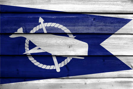 Flag of Nantucket, Massachusetts, USA, painted on old wood plank backgroundの写真素材