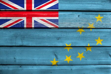 Flag of Tuvalu, painted on old wood plank backgroundの写真素材